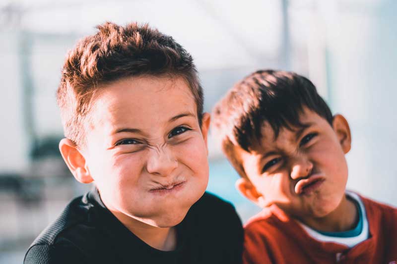 Two boys making goofy faces: How Are the Nation's Children Doing